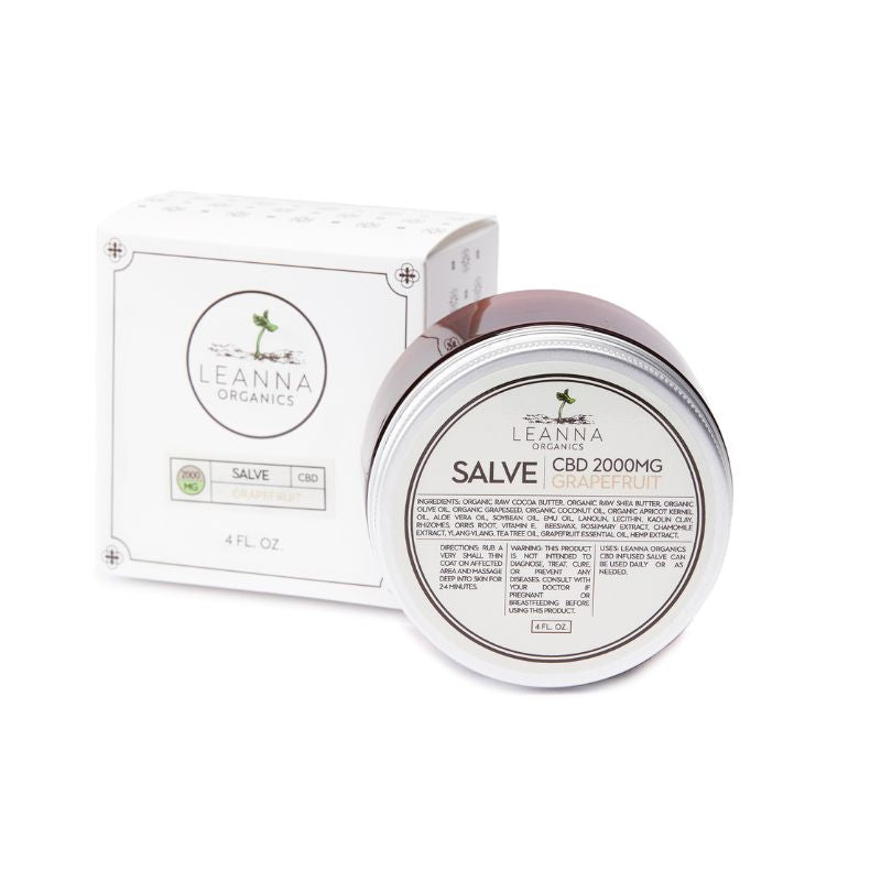 A jar of Leanna Organics Salve CBD 2000MG Grapefruit next to its white packaging box, displayed on a clean white background.