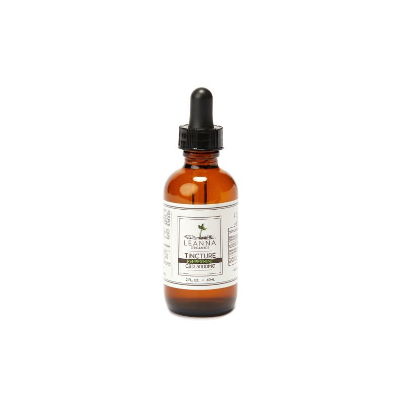 Brown glass CBD oil tincture bottle with dropper on a white background