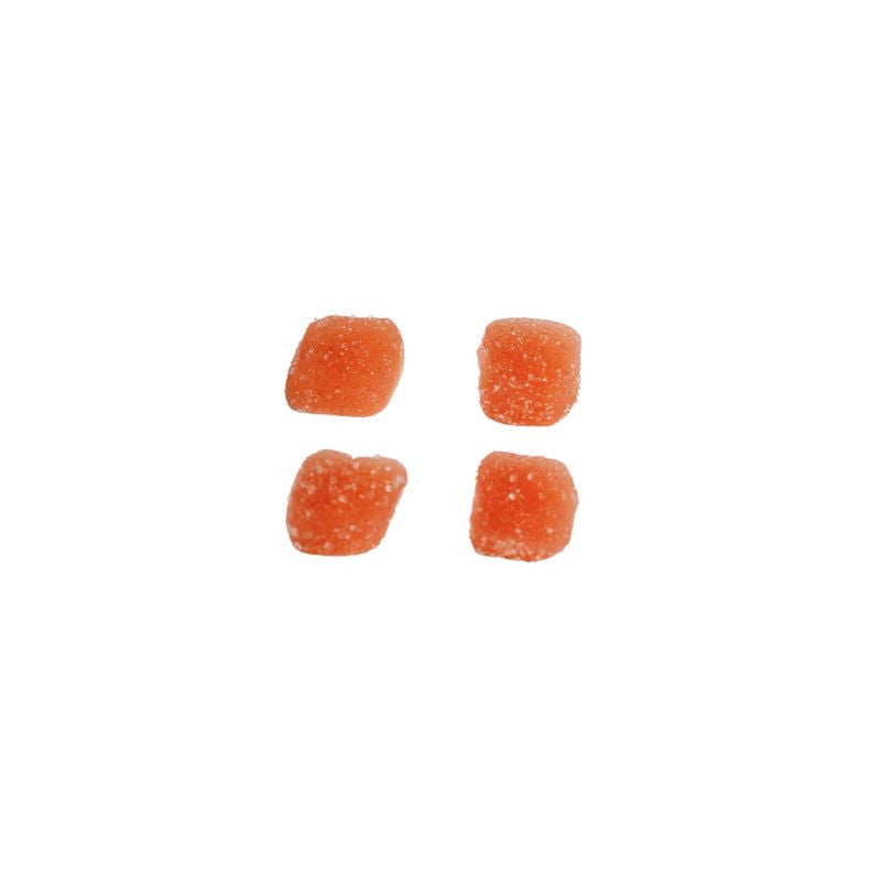 Four pieces of strawberry full-spectrum CBD gummies on a white background